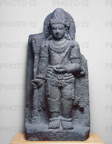 Bodhisattva Manjushri Holding a Blue Lotus (Utpala), 9th/10th century, Indonesia, Central Java, Central Java, Andesite, 74.6 × 35.4 × 22.9 cm (29 3/8 × 14 × 9 in.)