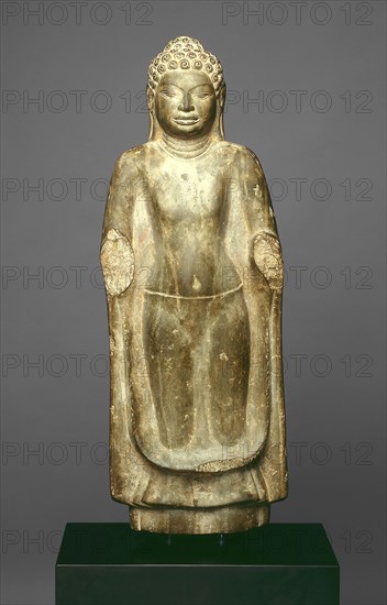 Standing Buddha, Dvaravati period, 8th century, Thailand, Thailand, Sandstone, 67.3 × 23.7 × 11.0 cm (26 1/2 × 9 5/16 × 4 5/16 in.)