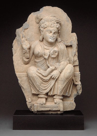 Goddess Hariti Seated Holding a Child, 2nd/3rd century, Pakistan, Ancient region of Gandhara, Gandhara, Gray schist, 61.0 × 43.2 × 16.5 cm (24 × 17 × 6 1/2 in.)