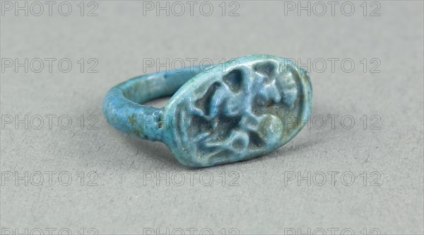 Ring: Figure of Bes playing frame drum, sa (protection) before him, New Kingdom, Dynasty 18 (about 1390 BC), Egyptian, Egypt, Faience, H. 1 cm (3/8 in.), diam. 2.2 cm (7/8 in.)