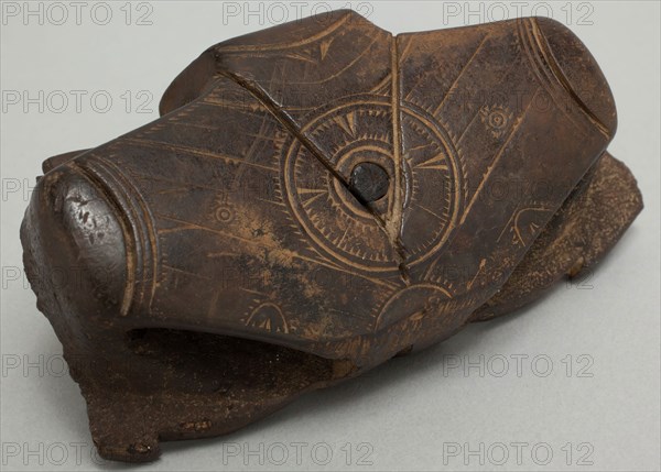 Okvik, Native American, Winged Object Fragment, c. 300, walrus ivory stained black by mineral (graphite) seepage, engraved surfaces, wooden inlays, 1 3/4 x 3 1/2 x 1 in. (4.4 x 8.9 x 2.5 cm)