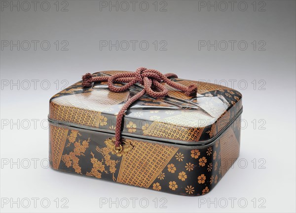 Unknown (Japanese), Cosmetic Box with Designs of Silk Incense Wrappers, 16th Century, Black and gold lacquer on leather and wood with silk cords and metal fittings, Overall: 4 3/4 inches × 11 inches × 8 5/8 inches (12.1 × 27.9 × 21.9 cm)