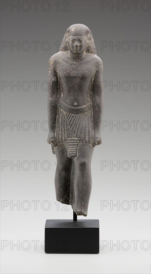 Egyptian, Statue of the Priest, Pa-ef-tchau-em-awy-Bastet, 595/589 BC, basalt, 9 1/4 x 2 3/4 x 2 3/4 in.
