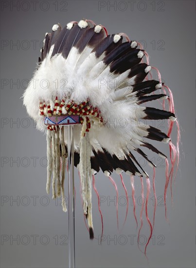 Crow, Native American, Feather Headdress, ca. 1890, leather, eagle feathers, ermine skins, glass beads and horse tail, Overall: 35 × 25 × 23 inches (88.9 × 63.5 × 58.4 cm)