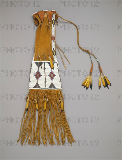 Cheyenne, Native American, Tobacco Bag, ca. 1880, deerskin, glass beads, flicker feathers, and brass hawk bells, Overall: 35 1/2 × 8 1/2 × 5/8 inches (90.2 × 21.6 × 1.6 cm)