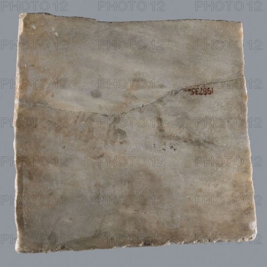 Epitaph of Gennadii; inscriptions; Greek inscriptions; tombstone; fine-crystalline blue-gray marble. Lower edge of the slab chipped; preserved part cracked transversely halfway up. In upper part, above the inscription, three Maltese crosses arranged symmetrically. Inscription in five lines, rounded letters, 1.5–2.0 cm high; average line spacing 2.5 cm. Dated 6th–7th century, Constantinople, Byzantine Empire 476–1453. Greek inscription; epitaph. Dimensions: height 29.5 cm, width 29.5 cm, depth 2.0 cm., A roughly square, flat slab with an uneven edge, showing a worn, mottled surface in shades of gray, beige, tan, and pale brown; there are subtle darker stains and smudges across the surface, a visible hairline crack running diagonally, and a small patch of reddish color near the crack; the background is a uniform medium gray.