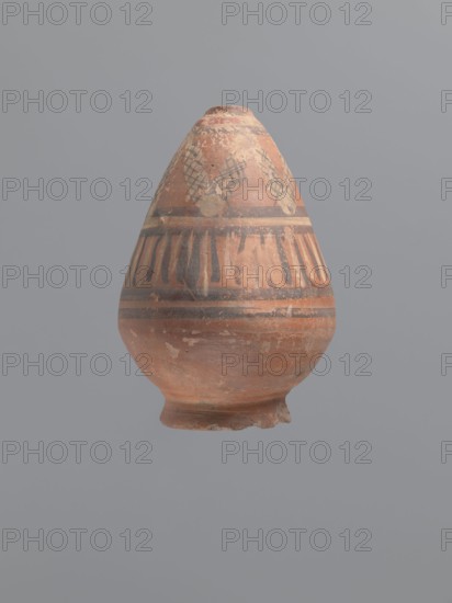 Bottle, Egyptian workshop. Painted Coptic pottery, 6th century, Egypt. Nile clay with distinct golden mica flakes, low porosity. Low, wide annular foot; belly walls widely flared at the bottom then bent inward at approximately one-third of the vessel; neck reflected. Decoration painted in black and white, banded: below the neck a white zigzag band adorned with a diagonal black check motif; below that a strip of vertical lines painted alternately in black and white, framed by double black stripes. LRO type item. Vessel; height 17.5 cm, body width 11 cm, outer rim diameter 8 cm., A rounded clay vessel with a narrow top and a flared foot, showing worn painted bands and geometric patterns, sits against a plain gray background; the vessel surface displays a mix of reddish-brown, terracotta, black, faded beige, and pale tan tones, with areas of paint loss and surface abrasion, and decorative horizontal stripes and vertical brushlike marks encircling its midsection.