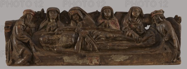 The Entombment - bas-relief probably fragment of a predella, unknown artist Mazovia, The Entombment iconographic, repossession Krakow, provenance unknown. The bas-relief is a rectangle; in the foreground a figure of Christ lying horizontally on a sheet supported by two men, hips covered with a perizonium, arms crossed on the perizonium, nail marks on the hands and legs. Legs stiffly outstretched, parallel. In the background, four busts: in the centre, Mary with her head bowed towards Christ, on her left a frontally positioned female bust, her gaze directed straight ahead. On the right, a frontally depicted Saint. John the Evangelist with hands folded in prayer. To the right of St. John, a female figure touching Christ's feet. The sides of the composition are closed by two men shown en trois quarts. An illegible coat of arms is on the front. DMR, after 1500 According to Walicki, Polska sztuka gotycka, p. 34, it comes from an unknown town in the Lowiecko district, from an unknown worksho...