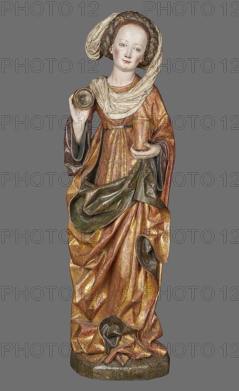 Figure of St. Mary Magdalene, ca. 1480, Southern Germany. Hollow wall sculpture, height 115.0 cm, width 35.8 cm, depth 16.2 cm. St. Mary Magdalene, depicted frontally in slight contrapposto with her head tilted left, holds a perfume box in her left hand and its lid in her right. The figure’s movement and hand gestures are elegant. The face has small, delicate features and a high forehead, framed by a thick braid woven with a ribbon; a white shawl draped over her head falls left, covers the breast, and is draped over the right shoulder. She wears a double gown: an over-dress of patterned golden fabric, short-sleeved and tied at the waist creating shallow radiating pleats, and an under-dress originally dark red, now darkened visible in the flared sleeves. A cloak is draped over the left shoulder, its pleated tail draped over the front and held by the left hand, revealing a green lining where folded back; on the right it forms deep, relatively stiff folds with semicircular and V-shaped ou...