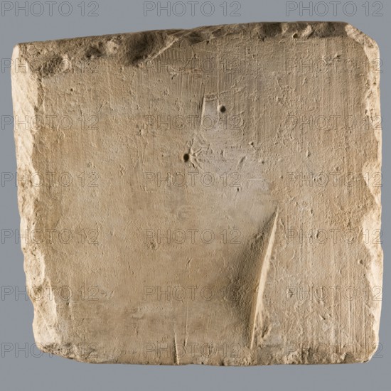 Greek dedicatory inscription, unknown author. Quadrangular limestone tablet with eight lines of Greek text. Abydos; Greek inscription; height 36.5 cm, width 39.0 cm, depth 7.1 cm; dated 25.06.257., A roughly square, flat stone slab with a coarse, uneven surface and worn, chipped edges sits against a neutral background; the slab is predominantly beige with areas of light tan and pale cream, showing a few shallow indentations and a couple of small round depressions, fine tool marks and scratches across its face, and a noticeable diagonal gouge on one side, while the background is a uniform muted gray.