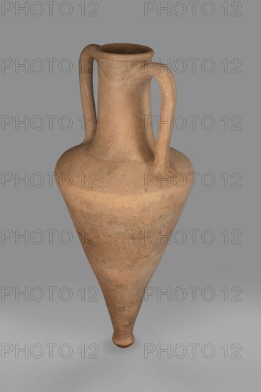 Transport amphora, Slightly sloping shoulders. High, narrow neck narrowing at the top and ending in a spout. Thick, ribbon-shaped handles divided by a groove. In the center — a recess pressed with a finger in wet clay. 1st half of the 4th century BC, Thasos. Vessel transport amphora. Height 66 cm; diameter 23 cm., A large clay vessel with a tapered, conical body and a rounded base sits against a plain background; the vessel has a narrow neck that widens slightly at the rim and two curved handles extending from the rim down to the shoulder, and its surface shows an earthy, terracotta color with mottled patches of darker and lighter brown and subtle textural variations.