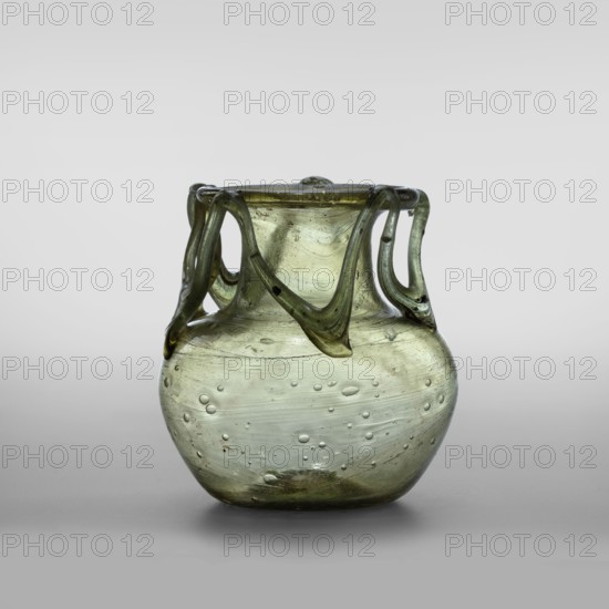 Flask, unknown eastern workshop; Scen.Gal.Klass.; Transparent glass, yellowish-green with applied thread decoration between the arms and the rim edge in the form of 10 sharp bends; free-blowing; miniature glass vessel, Barag type VI:9; outer diameter of the rim 5.50 cm; bottom diameter 3.90 cm; 4th century, Roman Empire 27 BC–476; vessel; weight 0.076 kg, A translucent glass vessel in pale green with a rounded body and a narrower neck, showing a group of looping applied glass handles around the rim that drape down toward the shoulder; the surface has a few scattered bubbles and faint striations, with subtle darker green variations and small obscure inclusions, set against a neutral light gray background.