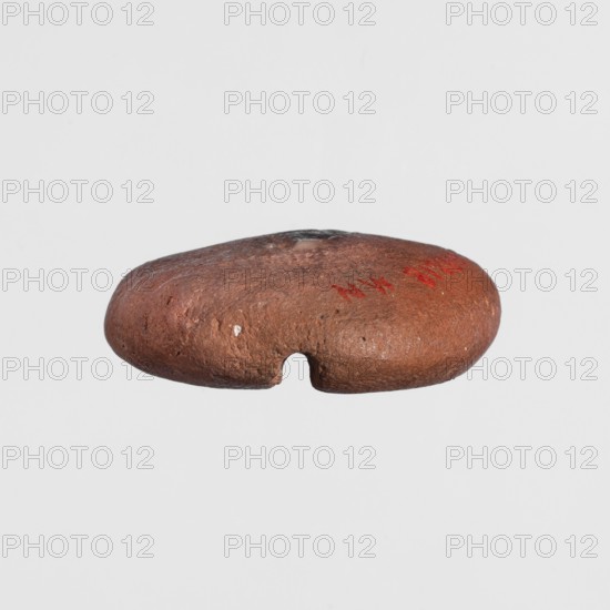 Scarab mold, scarabs, casts, ca. 1550–30 BC; New Kingdom–Ptolemaic Period, Egypt; mold, height 1 cm, width 3 cm, depth 2.8 cm, A rounded, flattened stone-like object in shades of brown with a rough, pitted surface and a small semicircular notch along its lower edge, showing a few small lighter spots and subtle darker patches on the top, photographed against a plain light gray background.