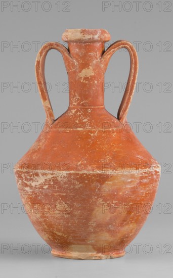 Amphora, unknown Roman workshop, Roman pottery, 1st–2nd century, Rome; Gaul France. Vessel amphora, height 14.6 cm, width 9.6 cm., A worn terracotta vessel with a bulbous body, narrow neck, flared rim, and a pair of curved handles rising from the shoulder to the neck; the surface shows patches of lighter wear and abrasion, rough texture, and uneven coloring in shades of reddish-brown, orange, beige, and pale cream against a neutral gray background.