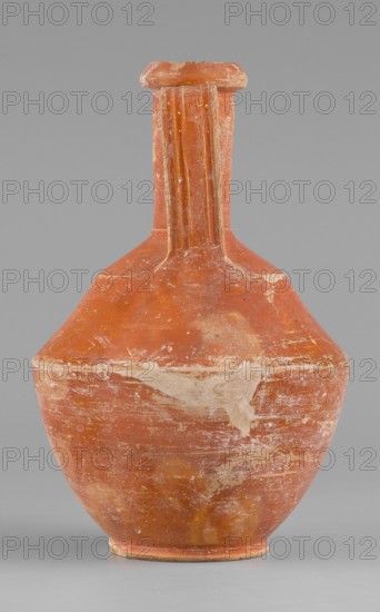 Amphora, unknown Roman workshop, Roman pottery, 1st–2nd century, Rome; Gaul France; vessel amphora; height 14.6 cm, width 9.6 cm., A single ceramic vessel stands against a plain gray background, showing a reddish-orange body with areas of lighter worn patches and whitish residue on its surface; the form has a rounded lower body that tapers into a wider shoulder and rises into a tall, narrow neck with a flat, slightly flared rim; the neck features vertical ridged details and the surface shows scuffs and scratches revealing paler clay beneath; colors visible include reddish-orange, pale beige, whitish markings, and gray in the background, with subtle darker and lighter variations across the vessel.