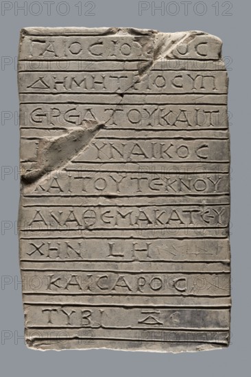 Greek inscription of thanksgiving, unknown author, tombstone inscription, 30.12.23 BC, Egypt; Greek inscription; height 24.0 cm, width 14.0 cm, depth 5.8 cm, A rectangular stone slab with a rough, weathered surface carved with horizontal grooves and a few incised lines creating rows; the slab is light gray with areas of darker gray and beige discoloration, showing a chipped corner near the top and a scraped, worn patch on the left side; the carved grooves and shallow relief marks are a slightly darker gray than the surrounding stone, and there are subtle shadows and highlights emphasizing the uneven texture and worn edges.