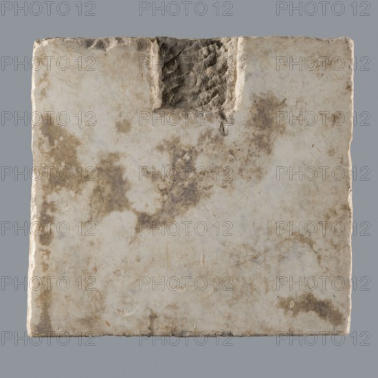 Latin grave inscription, unknown author, 2nd century, Roman Empire 27 BC–476, slab, epitaph, grave inscription, height 31 cm, width 28 cm, A square stone slab with uneven edges and a rough carved notch near the top center, showing a weathered surface with a mix of off-white, beige, tan, and brown mottled stains, small pits and scratches, and subtle variations in texture from smoother areas to rougher, eroded patches against a plain gray background.