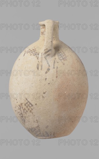 Jug, Excavated at Nea Paphos Cyprus. Cypriot pottery, Bronze Age Cypriot White Painted I. Jug with a large, oval, flattened belly, indistinct foot, sloping shoulders, low narrow neck with thickened outer edge of the spout. Small cylindrical vertical handle attached to the shoulders and spout, protruding slightly above the spout edge. Orange-cream clay with cream engobe. Painted geometric decoration in brown: neck with zigzag bands of three parallel horizontal lines between each band the highest at the spout edge; body with vertical stripes bounded by lines, centers of the sides with a single-line zigzag, between them two zigzags with a grid pattern four meshes wide. At the bottom, a continuous horizontal line intersects the delimiting lines. Condition: slight loss at the rim; surface heavily worn and decoration poorly preserved in many places. Dated 1800–1650 BC, Middle Cypriot period II–III; Cyprus., A rounded ceramic vessel with a narrow neck and a single strap handle, shown against ...