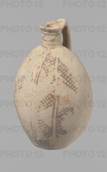 Jug, Excavated at Nea Paphos Cyprus. Cypriot pottery, Bronze Age Cypriot White Painted I. Jug with a large, oval, flattened belly, an indistinct foot, sloping shoulders, and a low narrow neck with a thickened outer edge of the spout. A small cylindrical vertical handle attaches to the shoulders and spout, protruding slightly above the upper edge of the spout. Orange-cream clay with cream engobe; painted geometric decoration in brown. Neck: zigzag bands of three parallel horizontal lines between each band the highest at the edge of the spout. Body: vertical stripes bounded by lines; on the centers of the sides a single-line zigzag; between them two zigzags with a grid pattern four meshes wide. A continuous horizontal line at the bottom intersects the delimiting lines. Condition: slight loss at the rim; surface heavily worn and decoration poorly preserved in many places. Dated 1800–1650 BC, Middle Cypriot period II–III. Vessel from Cyprus., A worn oval-shaped ceramic vessel with a short ...