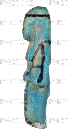 Shabti with baskets on the back;, Mummy-shaped funerary figurine, preserved fragment from the knees up. Arms crossed on the chest, hands level next to each other holding hoes. Rectangular basket slung on strings over both shoulders on the back. Long, smooth, three-part wig with headband; triangular face with proportional details and slightly closed eyes; painted facial details and headband. Painted inscription in a column separated by vertical lines on the front of the legs, starting just below the folded hands: ...of the soul belonging to Osiris.... ca. 1069–715 BC; Third Intermediate Period, 21st–23rd Dynasty, Egypt. Shabti; height 7.6 cm, width 3.2 cm., A slender, vertical turquoise-blue object with a rough, weathered surface and patches of lighter and darker blue, showing a few areas of brownish discoloration and grayish texture; there are several irregular black markings across its height, and the bottom edge has a rough, chipped appearance with off-white and gray tones.