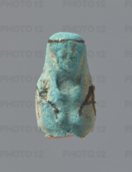 Ushabti, mummy-shaped figurine, funerary gift; preserved head and fragment of torso. Arms crossed on the chest, hands placed at the same level, next to each other, holding hoes in each hand. On the back a square basket is slung on strings over both shoulders. Head with a long, smooth, tripartite wig with a headband. Triangular face, details almost illegible. Headband and tools painted. ca. 945–ca. 715 BC; Third Intermediate Period, 22nd–23rd Dynasty, Egypt. Ushabti; height 3.7 cm, A small turquoise-colored figurine with a rounded top and a textured surface sits against a plain gray background; the object shows a few darker brownish streaks and spots, some lighter pale areas, and a rough, slightly pitted texture with an irregular base and a faint suggestion of a simplified face and body form.