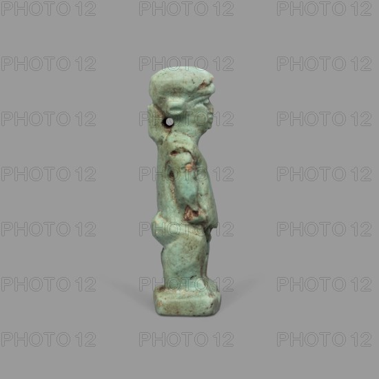 Amulet - Ptah the Dwarf Pataikos, Ptah the Dwarf myth., Egyptian deities, Egyptian religion, amulet depicting Ptah the Dwarf Pataikos as a naked, dwarfish man standing with his legs slightly apart, hands placed on his sides; figure on a rectangular base with a hole for hanging behind the neck. 664–332 BC, Late Period, Egypt; amulet; height 4.3 cm, width 1.7 cm., A small turquoise-green statuette of a standing human figure shown in side view, with a rounded head, defined facial profile, short stylized hair, and a visible ear; the figure has a slightly forward torso, bent arms, and a defined buttocks and legs standing on a rectangular base, with surface irregularities and areas of darker brownish spots and weathering; the background is a uniform medium gray.