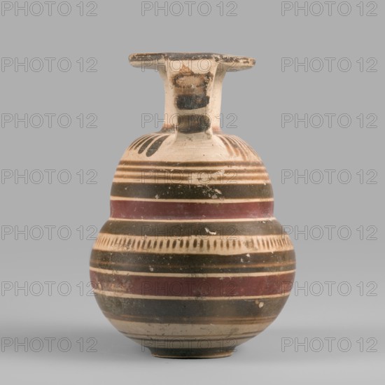 Italo-Corinthian aryballos, geometric motifs, Etruscan pottery, 600–575 BC, Etruria, aryballos vessel, weight 0.054 kg, height 7.7 cm, diameter 5.3 cm, A rounded ceramic vessel with a narrow neck and a flat, horizontal rim, shown against a plain light gray background; the vessel displays horizontal bands and patterned stripes in shades of beige, dark brown, reddish-brown, and black, with a few areas of surface wear and small chips revealing lighter underlying clay.