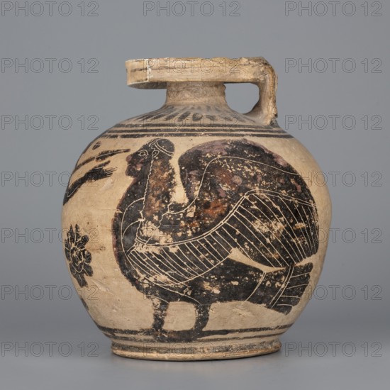Orientalizing aryballos with a depiction of Hermes, and the Sirens, Otterlo Painter c. 580–570 BC. Globular aryballos with a wide rim and a low neck; foot poorly defined. Decoration covers entire body; radial ornament on shoulders. Main decorative field bounded by two thin lines of varnish. Walking Hermes, holding a spear between two sphinxes. Precise engraved modelling with many details; wings of the sphinxes and some body parts covered with red retouch. Small amount of large infill ornamentation. Outer surface of foot covered with varnish; bottom decorated with concentric circles. Technology: matte varnish. Notes: full form but glued; surface contaminated; visible chips and cracks. Clay color: 10 YR 8/3 very pale yellow. Varnish color: 7.5 YR 2.5/1 black. Red color: 10 R 4/3 weak red. Attributed to Kamila Nocon, c. 570 BC, Corinth. Type: aryballos, vessel. Height 11.7 cm; diameter 11 cm; weight 0.280 kg; foot diameter 6.5 cm; spout diameter 5.5 cm., A rounded ceramic jug with a singl...