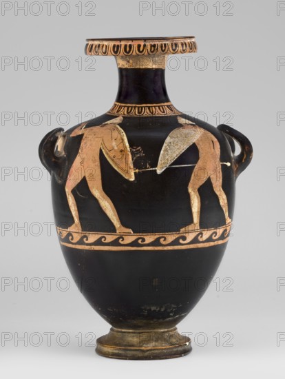 Red-figure hydria with a combat scene, Laghetto-Caivano Group c. 340–320 BC, Duel Painter 340–330 BC. Hydria decorated with a combat scene of two naked hoplite warriors fighting with long spears; they wear pointed helmets, hold round convex shields in their left hands, and wear greaves. Weaponry painted white with yellow retouching. Ca. 340–320 BC, Campania. Hydria vessel. Height 22.5 cm, width 15.6 cm, depth 13.3 cm, weight 0.612 kg., A black pottery vessel with a rounded body, narrow neck, and flared rim, decorated with a band of pale orange ornamental motifs around the rim and shoulder and a wavy pale orange band around the upper body; a pair of stylized human figures in pale orange are depicted on the main body, facing each other and holding round shields and spears, with simple limb and torso detailing; the vessel has a pair of small loop handles on the shoulder, a slightly raised foot with worn gilded tones, and visible areas of surface wear and patches where the pale orange deco...