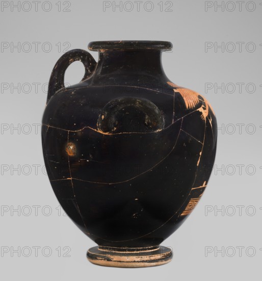 Red-figure hydria depicting the goddess Iris holding a kerykeion, Goluchów Painter Goluchowski Painter, Classified Gallo-Classical Scénée. Iris faces left with head turned right, right hand bent holding an elongated object, left arm outstretched; she has long hair, a laurel wreath, spread wings, wears a himation, and is barefoot. Decoration occupies the frontal belly and arms and is bordered below by a meander motif. Modelled rim with raised rounded edge and flat disc; low cylindrical neck smoothly merging into flat shoulders; bulky body; low cylindrical stem and ring-shaped foot conical inside with slightly convex underside. Circular cross-sectional vises just below the arms pointing upward; a third vise from lower neck to where arms join the belly. Technique: high-quality glossy red-figure gloss, dense, evenly distributed, smooth surface; cleaned clay; no visible turning traces. Condition: glued with visible conservation, surface dirt, secondary losses, chips, and areas with white co...