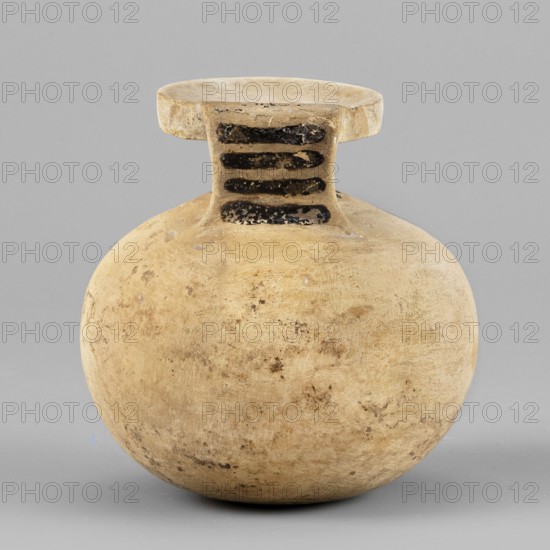 Aryballos with a depiction of a panther, Seated Panther Painter c. 620–590 BC. Spherical aryballos with a low cylindrical neck and squat belly. Image of a seated panther facing right with a long curled tail. Visible red retouching; details highlighted with engraved lines. One rosette of the filling ornament unfinished. Small amount of filling ornaments rosettes. Small rays near the neck. Four lines on the vase. Remnants of a ray ornament at the bottom. Technology: Smooth surface. Good quality glossy varnish. Notes: Reconstructed rim. Visible chips, cracks, and impurities. Clay color: 2.5 YR 8/3 pale yellow. Black color: 5 YR 2.5/1 black. Red color: 7.5 R 4/2 weak red. Provenance: Corinth. Type: aryballos vessel. Date: 620–590 BC. Dimensions: height 6.9 cm; width 6.6 cm; weight 0.066 kg; rim diameter 3.7 cm., A rounded ceramic vessel with a flattened rim and short neck sits against a plain gray background; the vessel is predominantly beige with areas of darker tan and brown discoloratio...