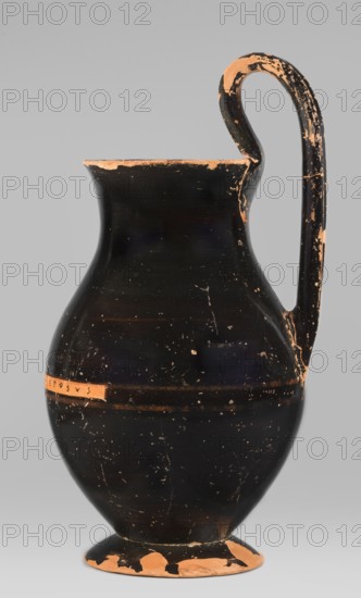 Olpe type of jug for liquids with inscription, unknown Attic workshop; Crito ca. 550–500 BC signature KRITONEPOIESEN, Greek ceramics, pottery marks, Greek inscriptions. Black-finished olpe with a clay-coloured cartouche at the point of maximum diameter inscribed KRITONEPOIESEN. Medium-sized olpe, rim edge slightly turned outwards. Low neck gently transitioning into a concave, spherical belly, clearly distinguishable from the low conical foot with a recess. The bottom of the vessel is slightly convex. The profiled handle vise is shaped with clearly distinguishable edges. On the inner side of the rim two clay nodules one reconstructed are visible, located 4.5 cm apart on the side of the handle. Dating: 550–500 BC. Origin: Attica, Athens. Object type: olpe vessel. Dimensions: height 26 cm, width 13.5 cm, depth 15.5 cm, weight 0.58 kg., A single ceramic jug stands against a plain gray background, showing a rounded body that tapers to a narrower neck with a flared rim and a curved handle ex...