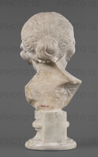 Portrait of a princess from the Julio-Claudian dynasty Julia?, unknown Roman workshop. Children's portrait, Roman sculpture, aristocracy Roman. The bust depicts a girl with a round, rather chubby face, turned slightly to the right; a rounded, elongated chin, and small, slightly pursed lips with a pronounced, wavy line of the upper lip. The almond-shaped, smooth eyes are rather shallowly set, with marked upper eyelids and barely visible eyebrows. The ears are carefully styled. The wavy hair is combed up and tied with a headband. At the back of the head, it is tied in a bun and a braid that falls down the middle of the head onto the smooth forehead. End of the 1st century BC–beginning of the 1st century AD, Roman Empire 27 BC–476. Sculpture; height 25.7 cm, width 16 cm, depth 12.5 cm, weight 11.5 kg., The image shows the rear view of a pale marble bust on a pale marble round pedestal against a solid gray background; the bust depicts the back of a head with hair gathered into a bun and sc...