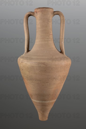 Transport amphora, transport amphora, amphoras, ancient ceramics, Greek ceramics, transport vessels. The walls of the body separate gently up to 2/3 of the height, then round markedly towards a long neck. The rim is defined by a profile, the rim edge is rounded in the form of a cylinder. Flattened strap handles, attached at the height of the rim, fall vertically towards the narrowing of the body. Fingerprints at the places where the handles are attached on the body. 3rd quarter of the 4th century BC, Mende Greece. Vessel. Height 71 cm, diameter 33.5 cm., A single large pottery vessel is shown against a neutral gray background, with a tall, tapered body that narrows to a pointed base and flares slightly into a rounded shoulder and short neck; two symmetrical curved handles extend from the neck to the shoulder. The surface shows an unglazed, matte texture with visible horizontal throwing marks and small pitting, and the color palette includes warm light brown, tan, and subtle reddish-bro...