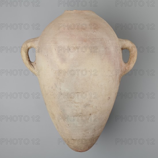 Large amphora with an ovoid shape and a rounded foot. Two small vertical vices placed on the body at the point of its greatest bulge at the base of the arms. The foot is hand-made; the body was wheel-made. Made of MD type marl clay Vienna System. Surface even. Sloping arms, along their bases on both sides of the body, are symmetrically placed with inscriptions in black paint labels, dockets. Above one of the vices, slightly toward the center of the body, are impressed cartouches of Hatshepsut and Thutmose III and a snake hieroglyph dz. Under one of the vices, a potter's mark of two intersecting lines. Color very light brown. Vessel incomplete — neck and spout missing. Cartouches of Hatshepsut and Thutmose III; two labels on the body. New Kingdom, 18th Dynasty reign of Hatshepsut and Thutmose III, Deir el-Medina grave 1370, ca. 1550–1295 BC. Vessel, height preserved 49.5 cm, belly diameter 30.5 cm., A large, rounded clay vessel with a tapered bottom and two loop handles on opposite side...