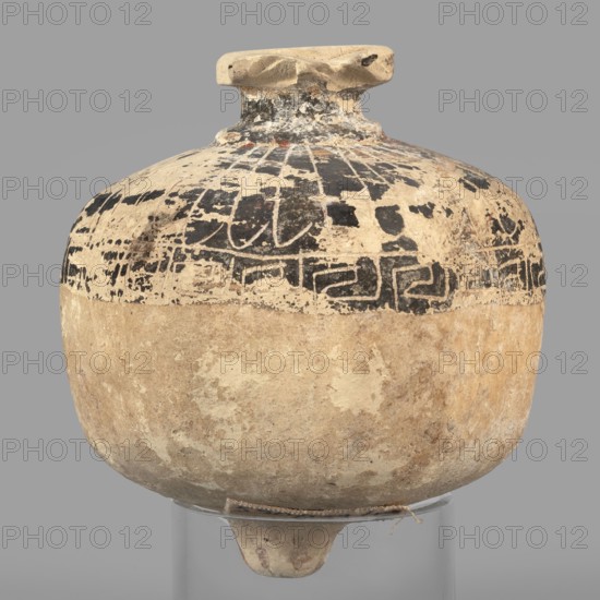 Vessel in the form of a pomegranate, 6th century BC, eastern Greece; terracotta vessel, height 7.5 cm, width 6.7 cm, depth 6.4 cm, weight 0.084 kg., A rounded ceramic vessel with a short neck and flattened rim sitting on a small stand, showing worn painted decoration on its upper half and an unpainted, textured lower half; the surface displays areas of chipped and faded paint with visible brush or pigment marks and some small abrasions; colors visible include beige, tan, off-white, black, and hints of brown and gray.