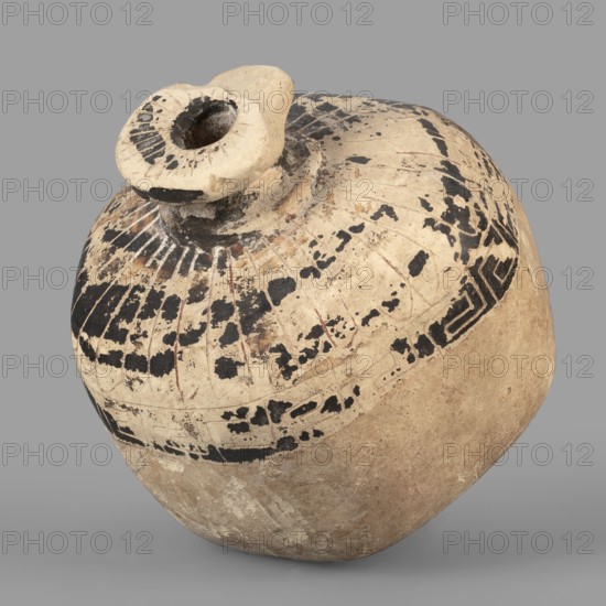 Vessel in the form of a pomegranate, 6th century BC, eastern Greece; terracotta vessel, height 7.5 cm, width 6.7 cm, depth 6.4 cm, weight 0.084 kg., A rounded ceramic vessel with a narrow, slightly raised neck and a small round opening, showing a worn painted surface in beige, cream, black, and hints of reddish-brown; the upper portion features a band of black geometric and linear painted marks interspersed with areas of missing pigment, while the lower body is more uniformly beige with patches of darker soil-like discoloration; the rim and neck display concentrated black paint and weathered texture, and the overall surface shows cracks, chips, and a matte, aged finish against a neutral gray background.