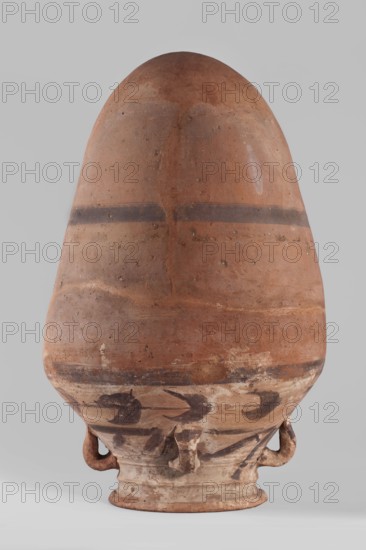 Vessel, Amphora with an ovoid body that tapers towards the bottom; rounded bottom. The vessel is widest at approximately 3/4 of its height. Shoulders are wide and sloping. Neck is wide, profiled, ending in a widening rim, flat on top. Four small cylindrical lugs connect the neck to the shoulders. Decoration painted and impressed: a 2 cm wide painted band halfway up the body and the same band at the junction of body and shoulders. Shoulders feature a painted floral decoration — a plant tendril with tripartite leaves in a purple-brown color; decoration not very carefully executed. Imprinted string lines visible around halfway up and slightly below the shoulders. Clay color light beige. Vessel glued together from several original fragments with missing pieces filled in with plaster. Surface worn in places. Date: 332–30 BC, Ptolemaic Period. Place of origin: Edfu. Function: vessel. Materials: clay; ceramics. Dimensions: height 57.5 cm; rim diameter 20.4 cm; body diameter 36 cm., A large ro...