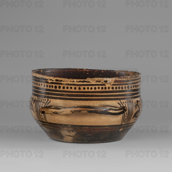 Skyphos mug with depictions of ducks. Late Geometric period, ca. 725–700 BC. Attributed to Attica. Skyphos with a profiled belly: just below the rim are two bands painted with a delicate line. Metopes depict ducks with long necks and legs, with stylized flowers in front; one bird image poorly preserved. Behind each bird's head is a swastika motif. Possibly silhouette technique. Vices placed at the maximum width of the belly. Inner surface covered with matte, faded paint; reserved line a short distance from the bottom; bottom undecorated. Technology: visible traces of turning. Varnish worn in places. Light yellow clay with many inclusions. Surface shows significant abrasions and chips. Condition: spout damaged; visible conservation additions old glue. Clay/paint colors: black ~7.5 YT 2.5/1; red ~10 R 4/4. Dimensions: height 9.0 cm, width 19.6 cm, depth 15 cm; weight 0.352 kg. Dated/attribution notes: Late Geometric ca. 725 BC; 9th–8th century BC attribution noted in earlier literature.,...