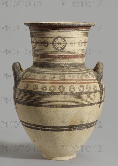 Amphora, unknown Cypriot workshop, Scen.Gal.Klass., Cyprus - partage. Geometric motifs, Cypriot pottery. Amphora with a low foot, wide neck, and upturned vices. Rounded belly. Surface covered with geometric decoration emphasizing the structure of the vessel; decoration composed of concentric bands and circles. 850–700 BC previously dated 750–600 BC; Cypriot-Archaic Period I. Cyprus, vessel. Height 54 cm, width 35 cm, weight 7.40 kg., An ancient pottery vessel with a flared rim and two small loop handles rising from the shoulder stands against a plain gray background; its surface shows a cream-colored base with bands and decorative patterns in black and reddish-brown, including concentric circle motifs and horizontal stripes that encircle the neck and shoulder, and the vessel shows areas of surface wear and variation in tone.