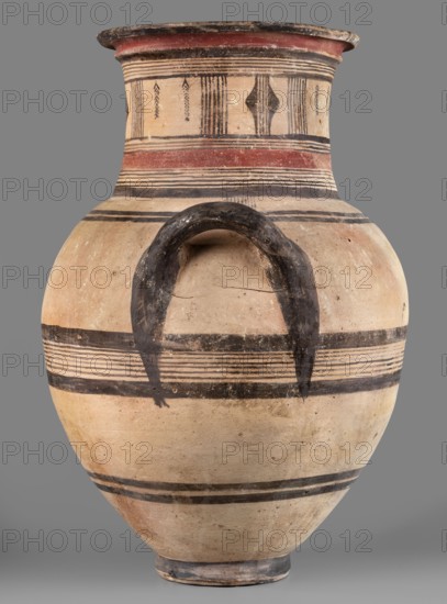 Amphora, Cyprus, geometric motifs, Cypriot pottery. Large amphora with two horizontal handles, rounded shoulders, and a neck narrowing in the middle, ending with a profiled rim. Decoration in red and black: on the neck formed by sets of lines, stripes, vertical lines, and triangles; on the belly by black lines and stripes. 850–750 BC. Place of origin: Cyprus. Vessel. Height 64.2 cm, width 42.4 cm., A large ceramic vessel with a rounded body, a narrow foot, and a flaring neck, painted in pale beige with bands and motifs in black and muted red; a dark semicircular handle-like feature is painted on the body; several horizontal black stripes and sets of closely spaced thin black lines encircle the vessel at different heights; the neck has vertical and geometric black designs and a broad muted red band near the top; the surface shows areas of wear and small spots of darker discoloration; the background is a uniform gray.