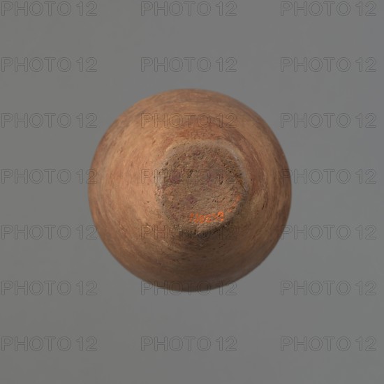 Vessel, Egyptian pottery, clay vessel, ceramics, Type HS vessel of a conical, slender shape, widest at about 3/4 of the height. The shoulders are quite wide, almost horizontal—slightly sloping. The neck is wide, short, funnel-shaped in its lower part, widening towards the rim from about half its height. The rim is wide, flat in the upper part, slightly rounded at the bottom, slightly asymmetrical. The bottom is flat, slightly asymmetrical. The neck was made separately and glued to the shoulders. The surface is even. The lower part of the vessel has been finished to approximately 3/4 of its height using a knife or similar tool. The outer surface of the vessel and the inner surface of the rim and neck are covered with a layer of dark red engobe and polished. Color: dark red. Vessel reconstructed from many original fragments; gaps filled with plaster. Date: c. 2686–c. 2181 BC Old Kingdom, provenance: Edfu. Function: vessel. Height 24.8 cm; diameter rim 8.9 cm; diameter shoulders 10.3 cm; ...