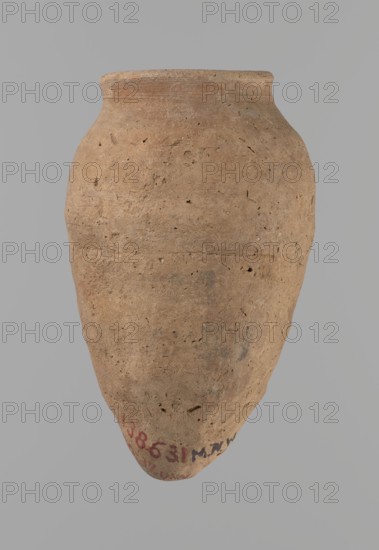Vessel with hieratic inscription, Egyptian pottery conical clay vessel Nile clay, NB according to the Vienna System, Old Kingdom, ca. 2686–2181 BC. Handcrafted, tapering to a pointed bottom; slightly irregular, widest at ~3/4 of the height; narrow sloping shoulders, short wide neck, very gently rounded widening rim rim damaged. Upper part shoulders, neck, rim turned. Around half the height a trace of joining of two separately made parts. Surface leveled, outer probably covered with a layer of engobe. Remains of a hieratic inscription in black on lower part of the belly. Height 13.2 cm; rim diameter 5.8 cm; body diameter 8.3 cm. Analogies: Petrie, Dendera pl. XVI.2; Hope, Akhmim fig.7 type AIVa 2bi; Reisner, Mycerinus p.212 fig.64; Brunton, Qau and Badari pl. LXXXI type 77N; Mace, Naga ed-Der II figs.87.11–25; Reisner, Naga ed-Der III figs.28–33; Petrie, Abydos II pl. XLIII; Keiser et al., MDAIK 40 fig.9b., A large rounded clay vessel with a narrow rim and a tapered pointed base, shown ...