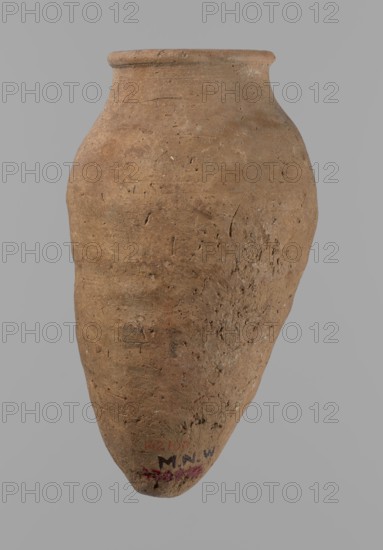 Vessel with hieratic inscription, Egyptian pottery vessel of clay, Old Kingdom, ca. 2686–ca. 2181 BC; findspot Edfu; height 15.1 cm, rim diameter 5.6 cm, body diameter 8.2 cm. Comparative material: Petrie, Dendera, pl. XVI,2; Hope, Akhmim, fig. 7, type AIVa 2bi; Reisner, Mycerinus, p. 212, fig. 64 3,4; Brunton, Qau and Badari, pl. LXXXI type 77N — earlier dated to the IVth–Vth Dynasty; Mace, Naga ed-Der II, figs. 87.11–14, 16–25; Reisner, Naga ed-Der III, fig. 28–33; Petrie, Abydos II, pl. XLIII, 79–80; Keiser, Avila, Dreyer, Jaritz, Laskowska-Kusztal, MDAIK 40, fig. 9b., A large, rounded clay vessel with a narrow neck and flared rim, shown against a plain gray background, with a rough, textured surface that has small pits and scratches. The vessel is predominantly brown with variations of lighter and darker brown tones and small flecks of pale and reddish-brown. The surface shows unevenness and some areas of wear and abrasion.