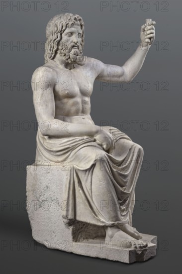 Statue of Jupiter of the Capitoline type, unknown Roman workshop. Jupiter Zeus seated on a throne set on a rectangular base. Seated stiffly with torso slightly reclined; raised left hand holds a scepter, right hand rests on right knee, right foot slightly forward. Legs covered with a himation that also covers the back and left shoulder. Muscular torso, strongly developed shoulders, naturalistic modeling. Head disproportionately large; face with slightly open mouth. Hair parted from the center anastole. Beard thick, arranged in strands on the sides and in curls on the chin. Roman sculpture, Roman copy after a Hellenistic variant of Phidias's statue of Zeus the Olympian. Late 2nd–3rd century AD Roman Empire. Sculpture, weight 930 kg., A seated marble statue of a bearded man with long wavy hair, shown shirtless with a draped cloth over his lower body, sitting on a block-like seat; his right arm is raised and bent at the elbow while his left arm rests across his lap, and his feet are bare ...