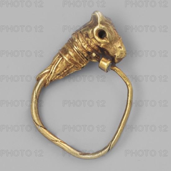 Earring decorated with a bull's head; bucranium ornament; pendants; goldsmithery; 3rd century BC; Greece; jewelry; height 1.5 cm; width 1.1 cm; depth 0.4 cm; weight 1 g; maker, found in Goluchów Greater Poland Voivodeship., A single gold-colored metal ring with a sculpted animal head forming one end; the head has a rounded eye socket and a pronounced snout, and the adjoining section shows wrapped, textured detailing. The band is thin and irregular, with visible bends and subtle surface scratches, and the overall colors visible are gold and shades of gray in the background.