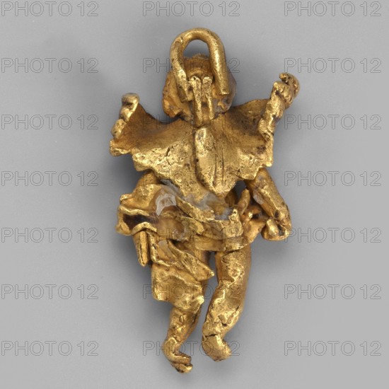 Eros-shaped pendant, Goluchów Greater Poland Voivodeship. Pendant in the shape of a standing Cupid with simplified hands; facial features blurred. Goldsmithery, necklace ornament from the Black Sea region, 1st half of the 3rd century BC. Materials: gold. Type: jewelry pendant. Dimensions: height 2 cm, width 1.1 cm, depth 0.4 cm; weight 4 g. Subjects: Eros mythology, classified Gallic scenography., A small metallic object shaped like a stylized human figure with a loop at the top, shown against a plain light gray background; the figure appears textured and irregular with a few folded, layered elements suggesting clothing or drapery, and has a few rounded limb-like protrusions and a raised central ridge on the torso; the visible colors are gold with small areas of pale translucent white and subtle darker gold or brownish tones.