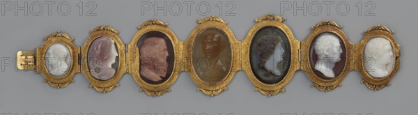 Bracelet with cameos, made by, attributed to Roniker, E. purchased; portraits, gems, goldsmithery; Roman period/19th century AD; place of origin, jewelry; height 4.2 cm, width 19.5 cm, A long decorative object composed of a row of connected oval frames in a metallic gold color, each containing a carved oval relief of a human profile or bust in various stone-like hues; the reliefs show a range of skin-toned shades including white, off-white, pinkish, brown, and dark gray, with hair and facial features carved in similar tones; the gold frames have ornate scroll and foliate detailing and small hinge elements between some sections, and the background behind the object is a uniform gray.