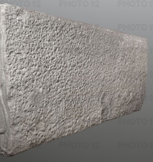 Sarcophagus with a depiction of a married couple and a shepherd, unknown Roman workshop. A large Roman sarcophagus with strigilla S-shaped grooves on the front forming a central medallion, decorated with a standing, thoughtful shepherd leaning on a shepherd's staff pedum. On the sides of the front are figures presumed to be the deceased, standing against draped fabrics parapetasmata: on the left, a woman in a tunic and long cloak palla holding a scroll volumen in her left hand; on the right, a man in a tunic and toga with a contabulatio specially wrapped hem holding a scroll in his left hand and wearing mullei leather military boots. Both front figures have incompletely finished heads. The side walls show reliefs of a seated griffin with a lion's head; the left wall near its lower left corner has an opening into the interior. The lower left corner of the right wall is missing and the rear wall is rather carelessly worked. The piece shows abrasions and damage, particularly to the corner...