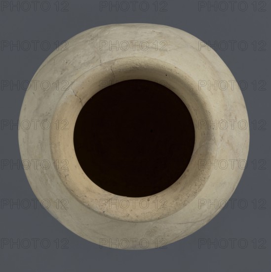 Globular vessel, unknown Northern Mesopotamian workshop, globular vessels, clay vessel, Early Jazira III period ca. 2600–ca. 2350 BC / Early Dynastic III period ca. 2600–ca. 2350 BC, vice-less vessel for children's graves, Al-Jazira Syria/Iraq, Mesopotamia, Northern Mesopotamia Khabur basin, Tell Rad Shakra northeastern Syria, globular vessel with a distinct, slightly flared conical neck ending in an outwardly extended and everted rounded rim, ca. 2600–ca. 2350 BC, height 19 cm, width 18.2 cm, A top-down view of a round vessel with a wide circular opening showing a dark interior, the exterior surface of the vessel is a light beige with visible subtle cracks and texture, and the background is a muted gray-blue.